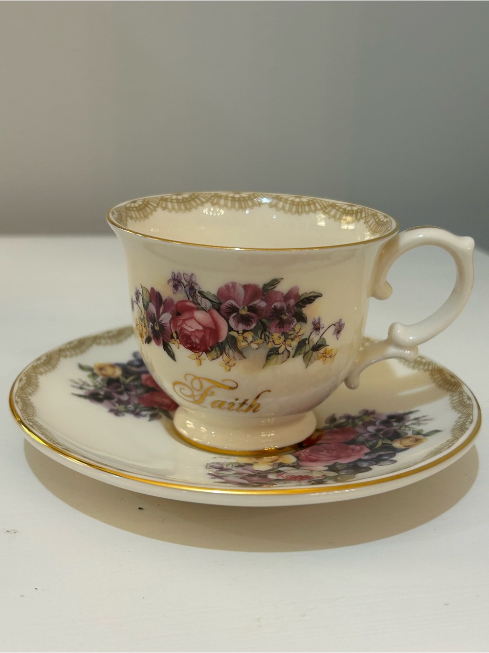 Sandy Clough “Faith” Cream Floral Teacup and Saucer Set with Gold Trim